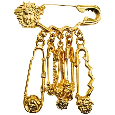 versace brooch pins.